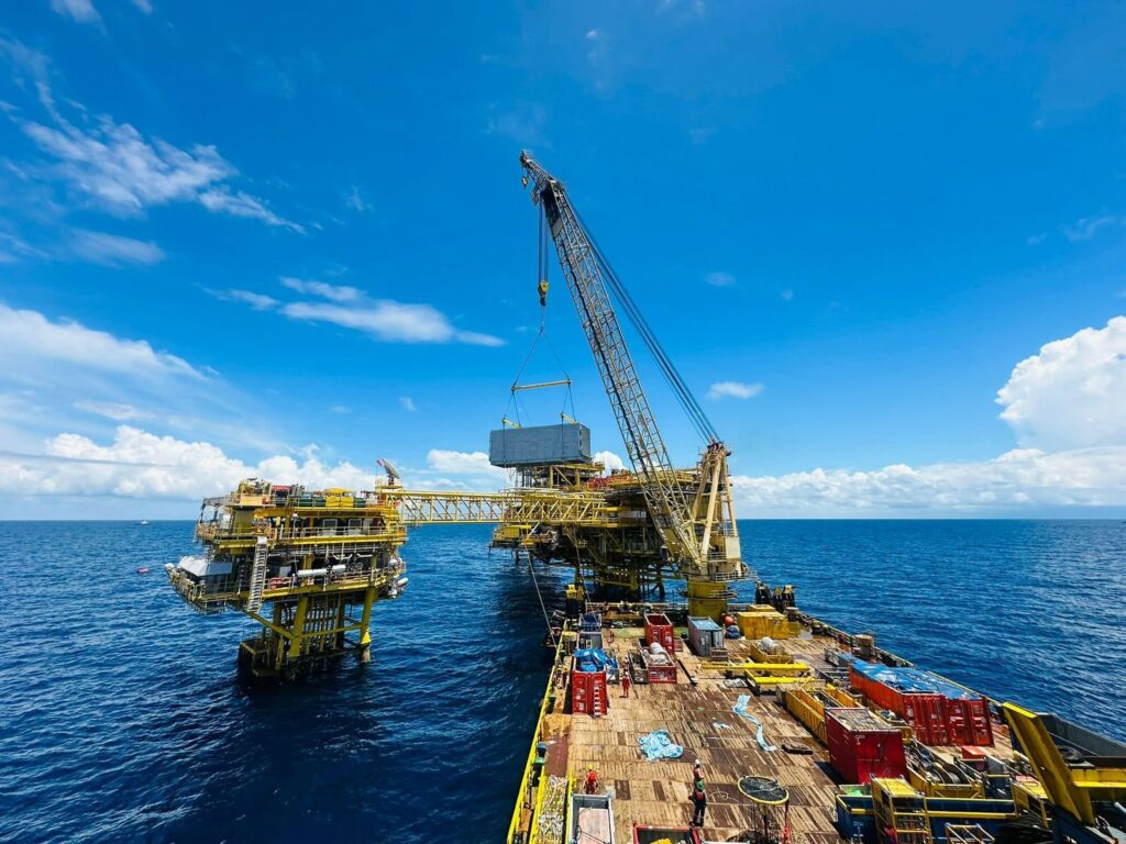 Crane vessel lifting a module onto an offshore platform in the Gulf of Thailand